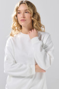 Buzo oversize cuello redondo unicolor con hombro caído
