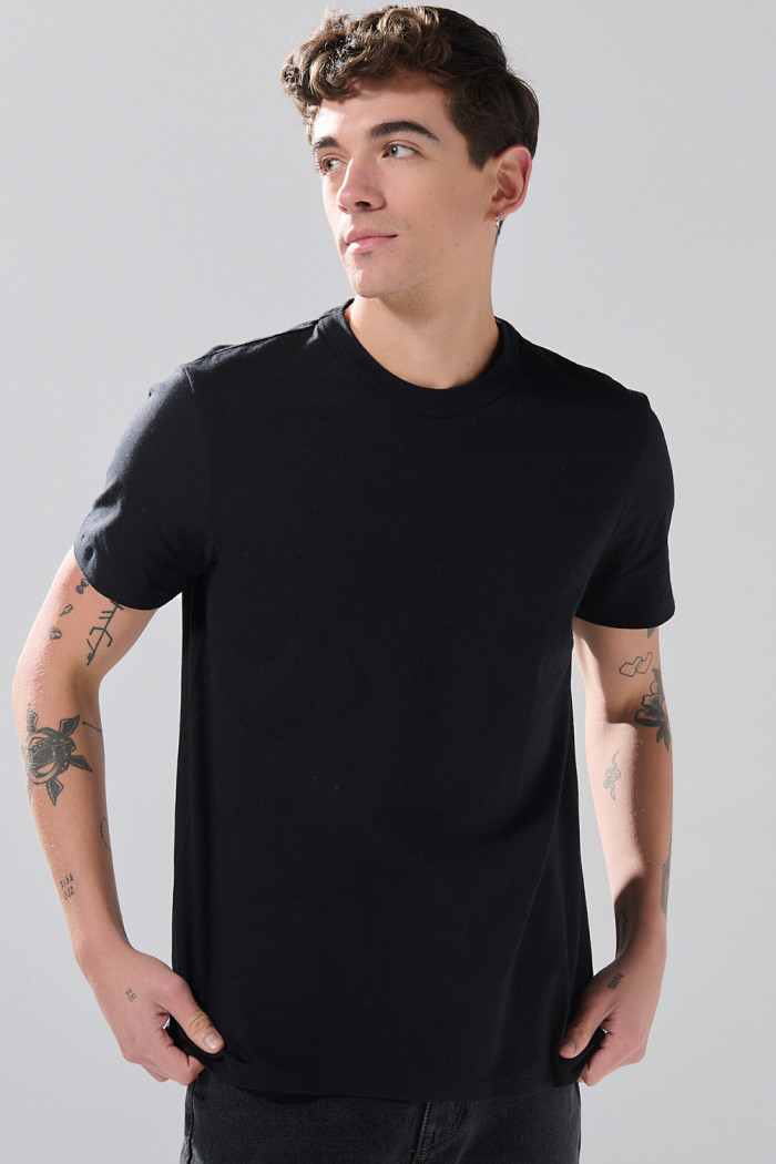 Camiseta en algodón ajustada cuello redondo unicolor
