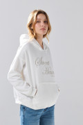 Buzo oversize crema claro con capota y diseño celestial
