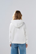 Buzo oversize crema claro con capota y diseño celestial
