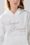 Buzo oversize crema claro con capota y diseño celestial
