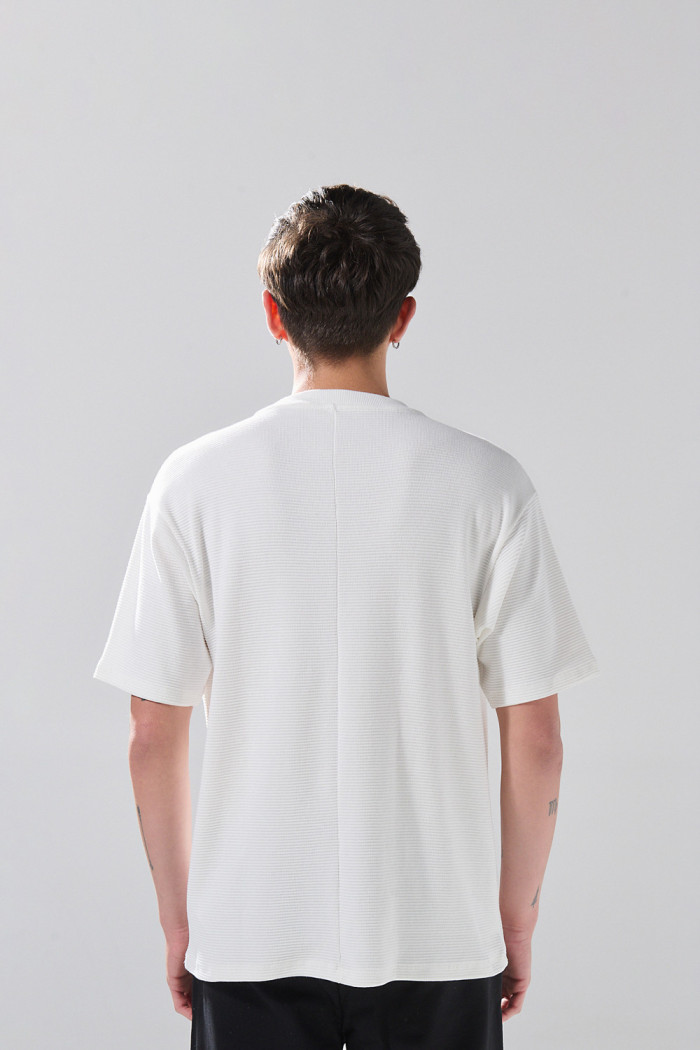 Camiseta unicolor oversize manga corta con corte posterior
