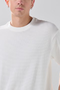 Camiseta unicolor oversize manga corta con corte posterior

