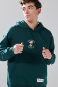 Buzo con capota verde oscuro oversize y diseños de Snoopy
