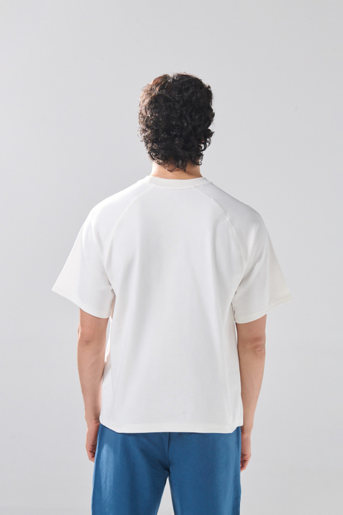 Camiseta en algodón con manga ranglan corta unicolor
