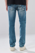 Jean slim azul medio infaltables con desgastes y tiro bajo
