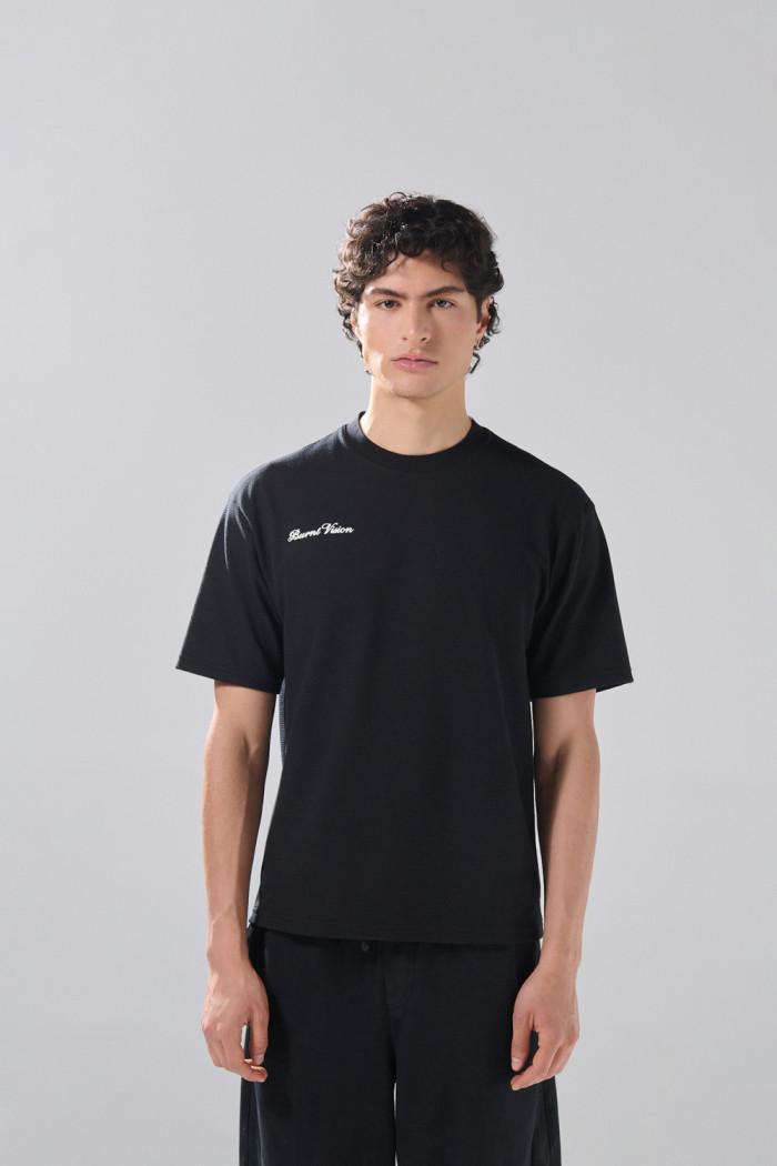 Camiseta oversize unicolor manga corta con texto de Boho Club
