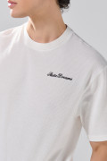 Camiseta oversize unicolor manga corta con texto de Boho Club
