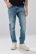 Jean slim infaltables azul medio tiro bajo con desgastes
