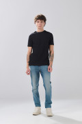 Jean slim infaltables azul medio tiro bajo con desgastes
