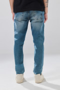 Jean slim infaltables azul medio tiro bajo con desgastes
