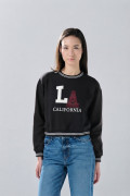 Buzo oversize negro college cuello redondo con manga ranglan
