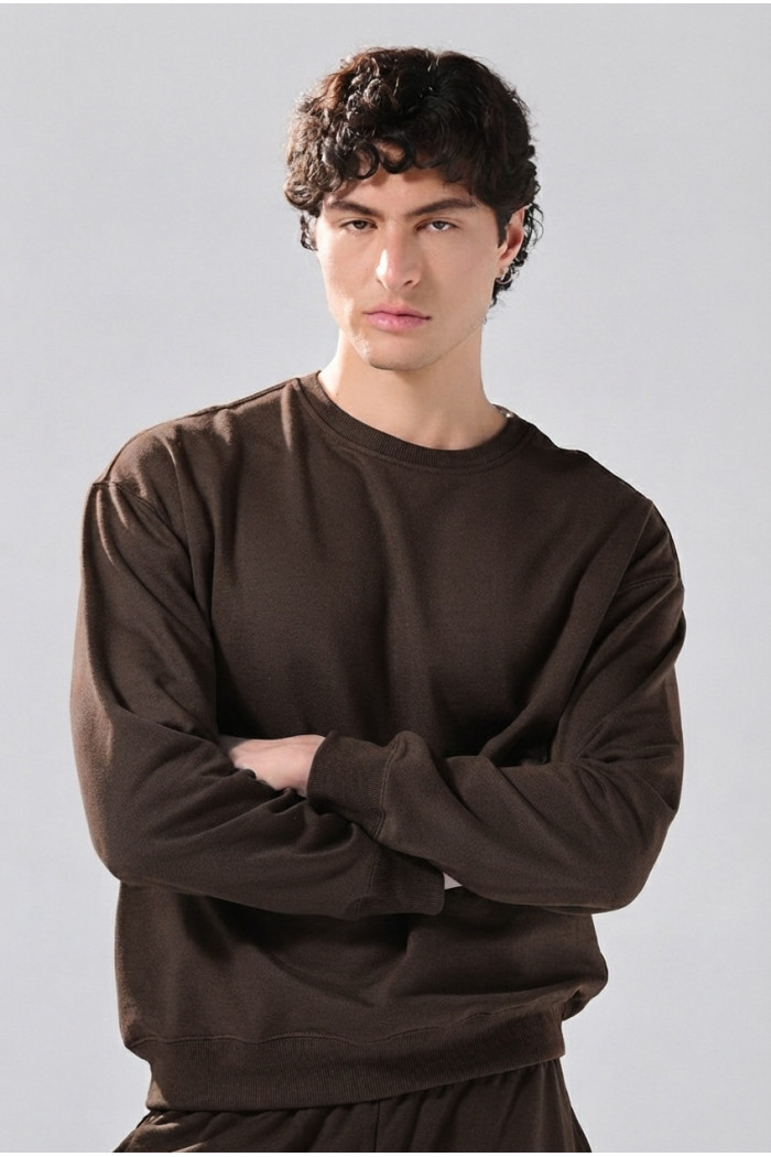 Buzo oversize cuello redondo unicolor en tela perchada
