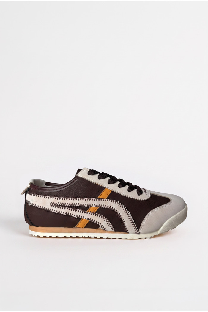 Zapatillas de estilo clásico, suela de caucho de perfil bajo.
