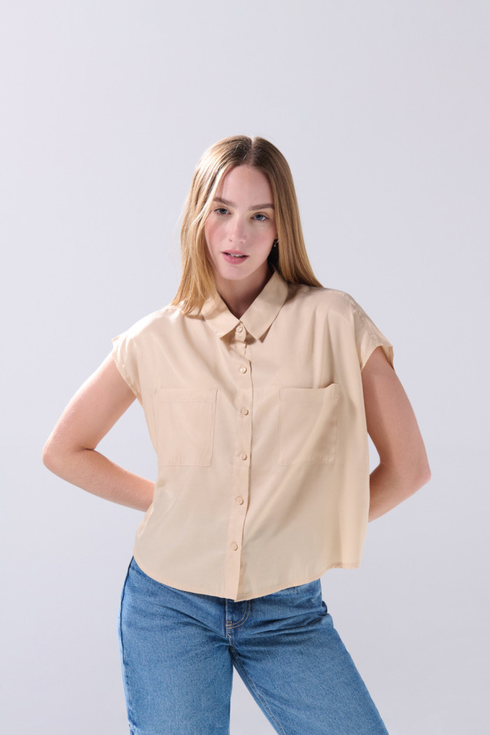 Blusa manga corta unicolor con nudo y estampados