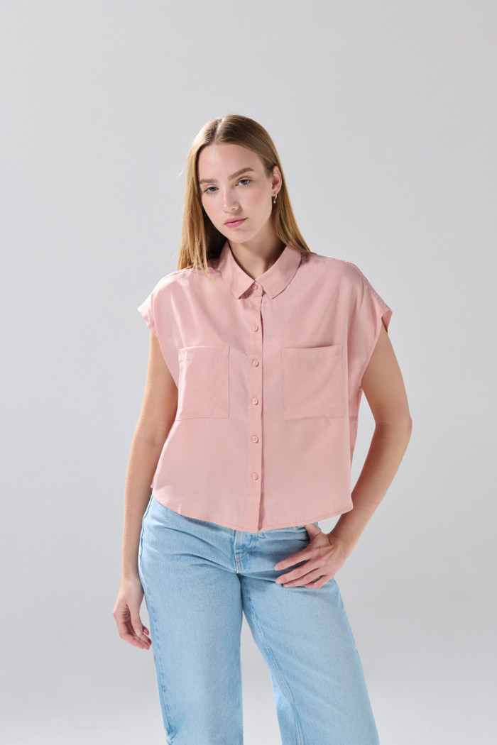 Blusa manga corta unicolor con nudo y estampados