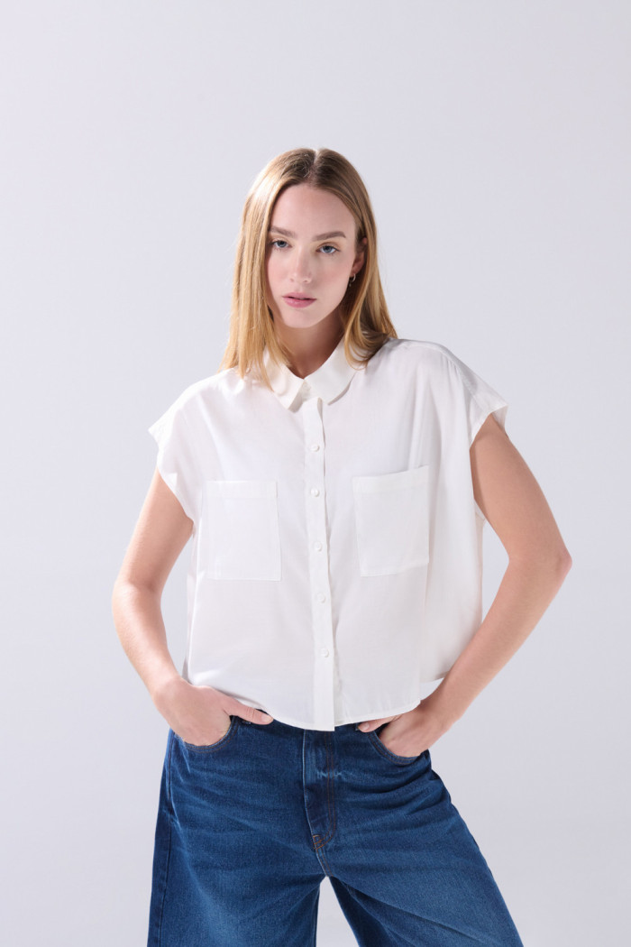 Blusa manga corta unicolor con nudo y estampados