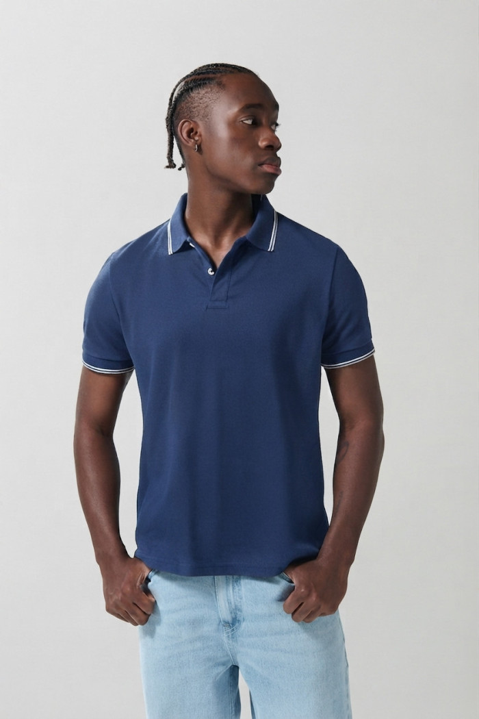 Camiseta polo infaltables manga corta unicolor con botones
