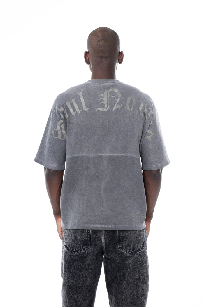 Camiseta estampada unicolor oversize con cuello redondo
