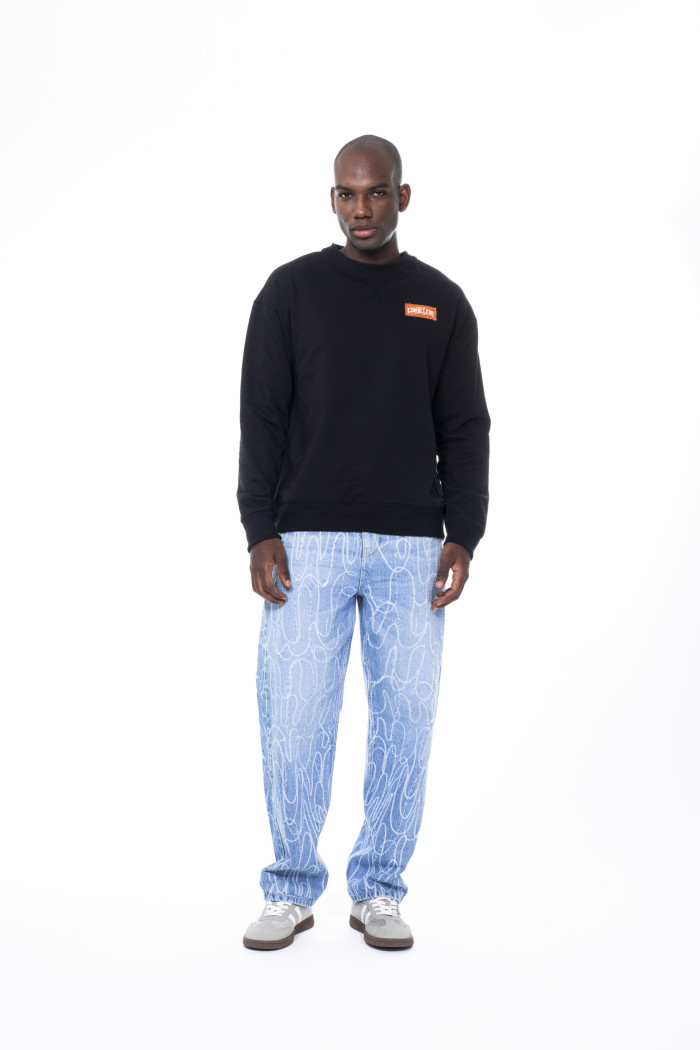 Buzo del Festival Cordillera oversize negro cuello redondo
