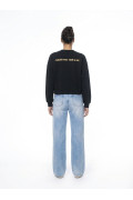 Buzo cuello redondo negro oversize de Carlos Vives
