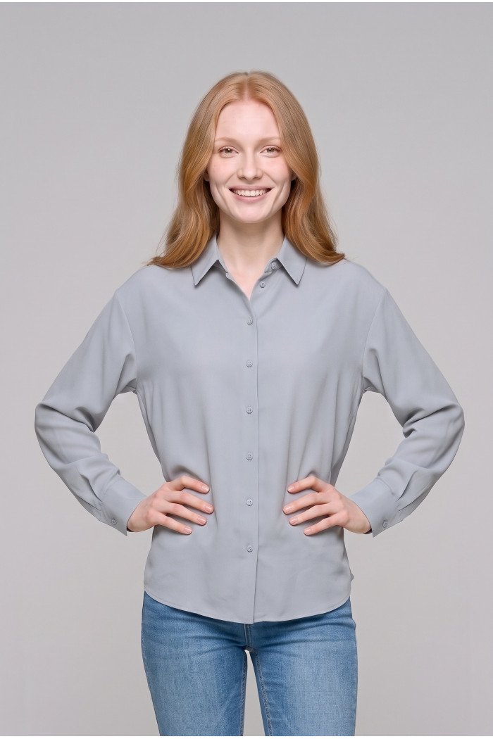 Blusa unicolor oversize manga larga en algodón