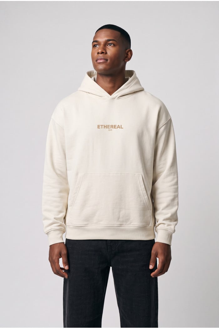 Buzo crema claro oversize con capota, bolsillo y textos
