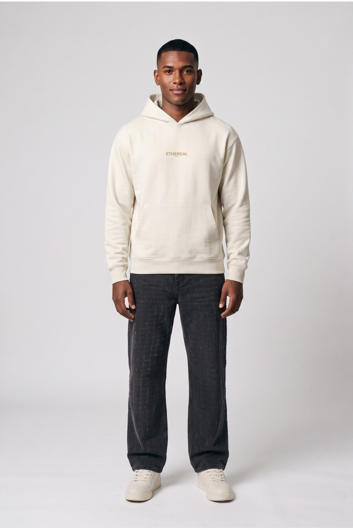 Buzo crema claro oversize con capota, bolsillo y textos
