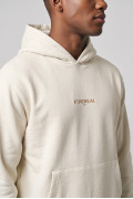 Buzo crema claro oversize con capota, bolsillo y textos
