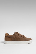 Tenis unicolores casuales con perforaciones y suelas planas