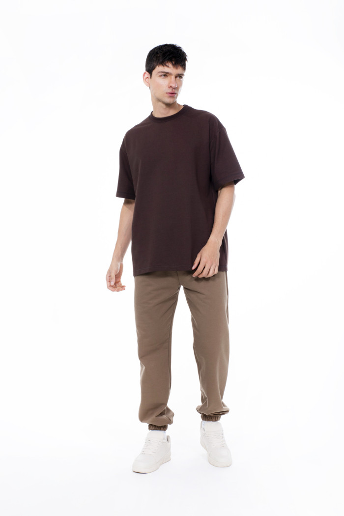 Camiseta unicolor en tela pesada con manga corta oversize
