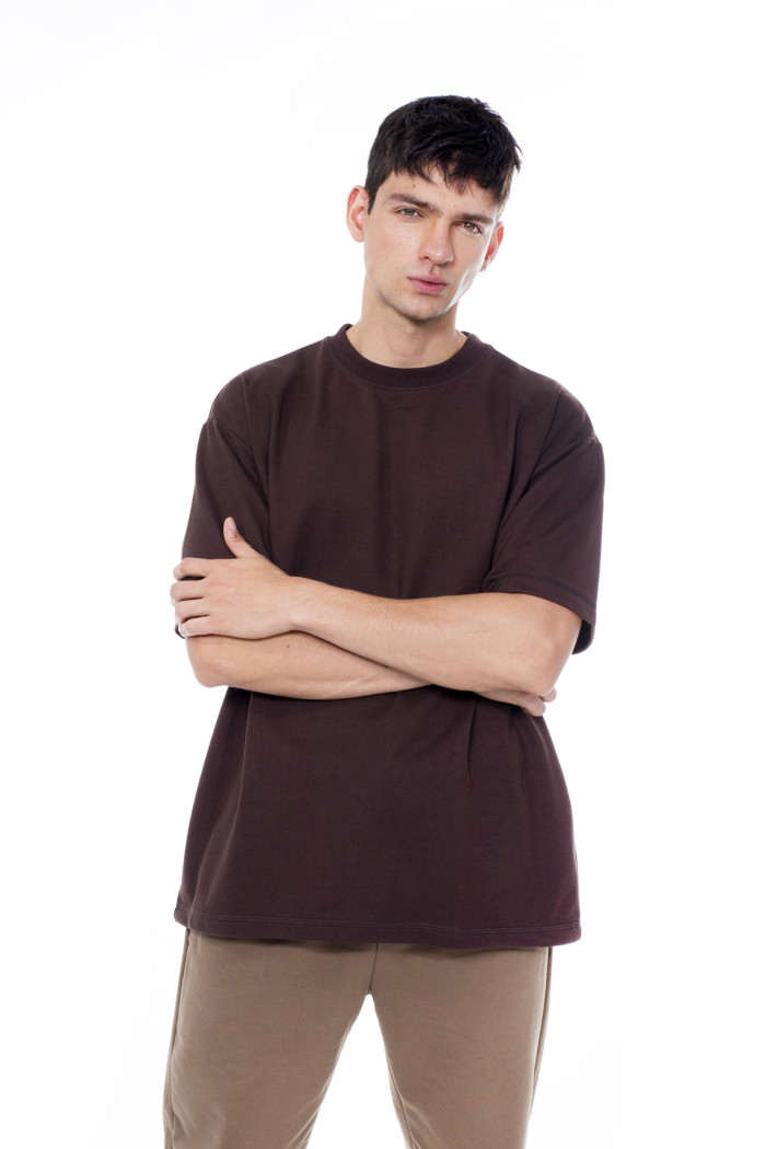 Camiseta unicolor en tela pesada con manga corta oversize
