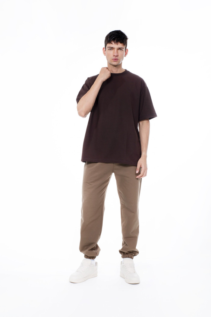 Camiseta unicolor en tela pesada con manga corta oversize
