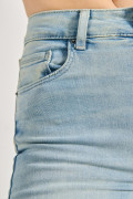 Jean súper tiro alto jegging azul con desgastes sutiles