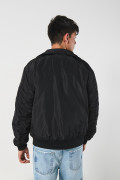 Chaqueta bomber unicolor con cuello trucker y cremallera