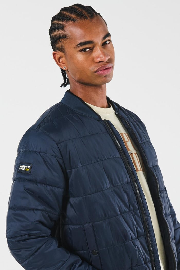 Chaqueta unicolor bomber acolchada con acabados en rib