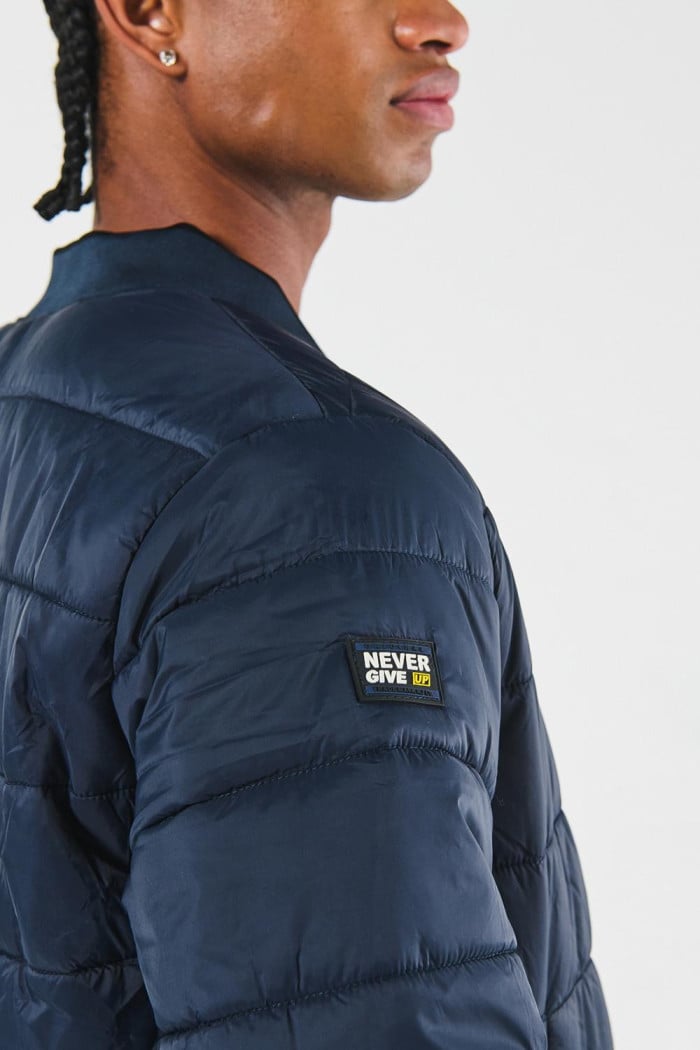 Chaqueta unicolor bomber acolchada con acabados en rib