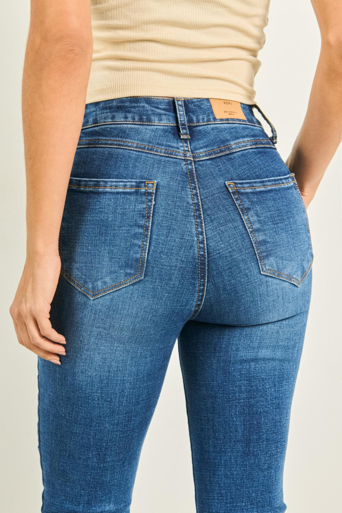 Jean súper tiro alto jegging azul con costuras cafés