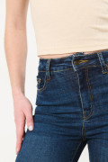 Jean súper tiro alto jegging azul oscuro con costuras cafés