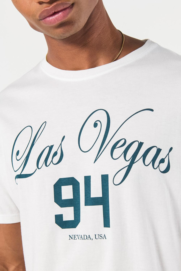 Camiseta crema manga corta con arte de Las Vegas