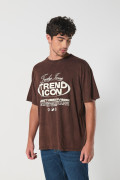 Camiseta kaki oversize manga corta con texto urbano