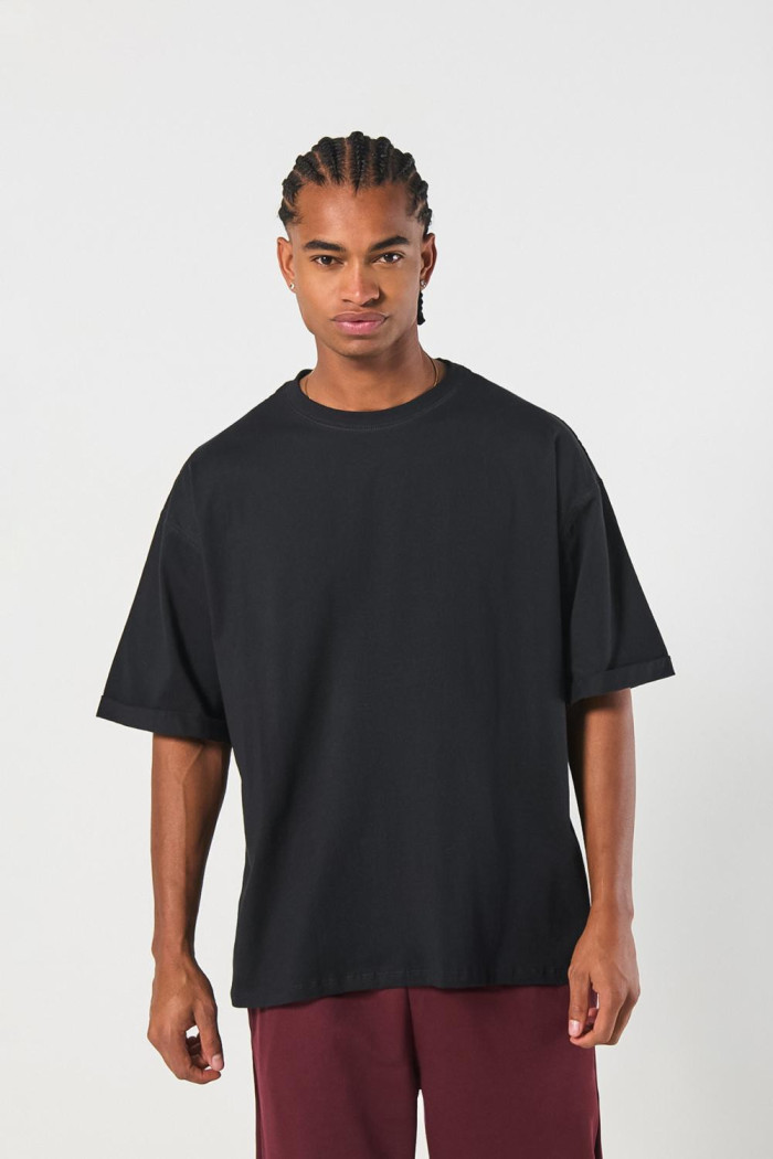 Camiseta oversize unicolor manga corta con doblez en puños