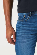 Jean skinny tiro bajo azul con ajuste ceñido y cremallera