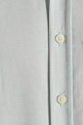 Camisa manga corta unicolor con bolsillo y botones en frente