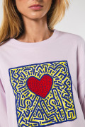 Camiseta oversize lila manga corta con arte de Keith Haring