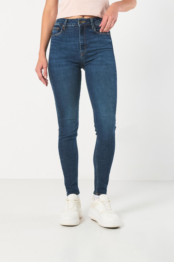Jean jegging azul oscuro con cremallera y tiro súper alto
