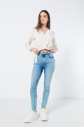 Jean jegging azul con desgastes sutiles y tiro súper alto