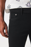 Jean ajustado skinny negro con cremallera y tiro bajo