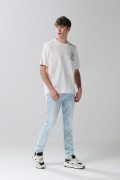 Camiseta oversize cuello redondo crema con arte de playa