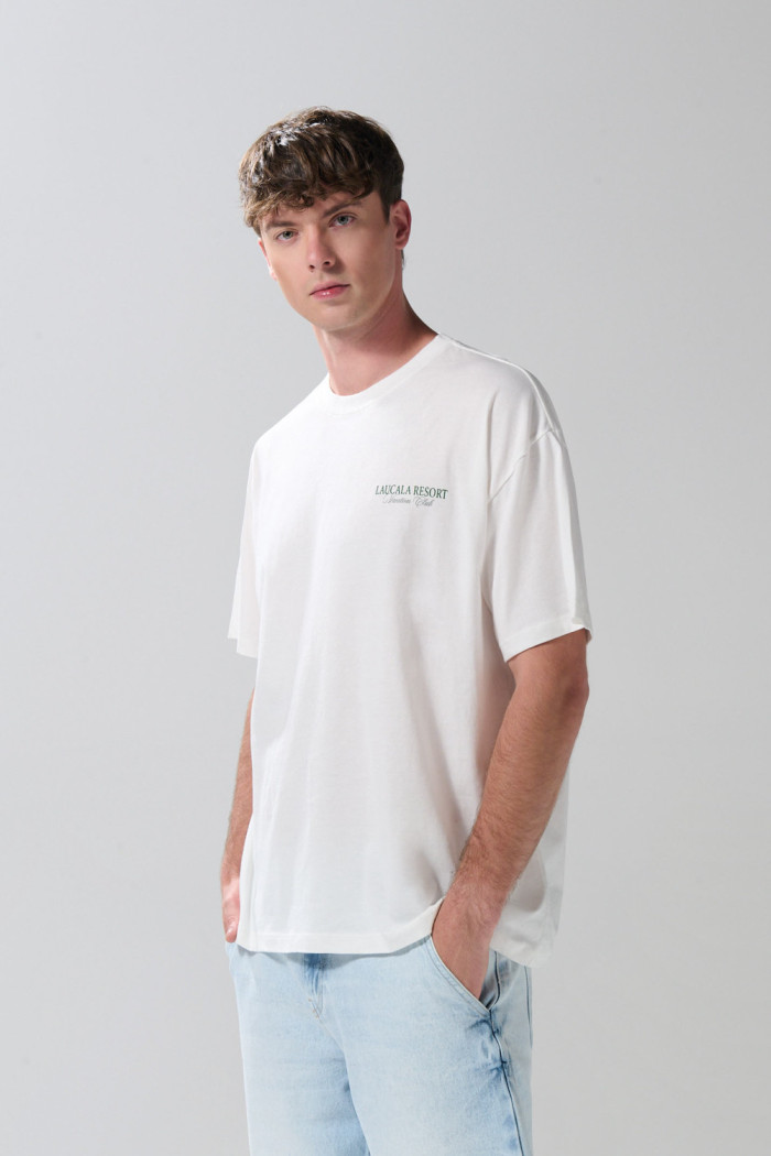 Camiseta oversize crema manga corta con diseños de playa